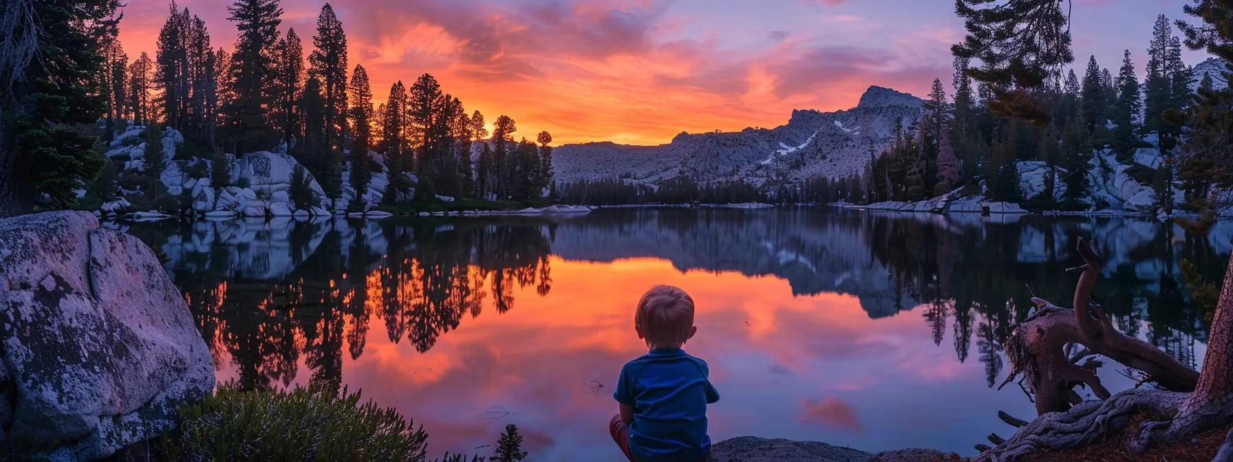 a vibrant sunset illuminates a tranquil lake, reflecting the fiery hues of orange and purple across its glassy surface, framed by silhouetted pine trees.