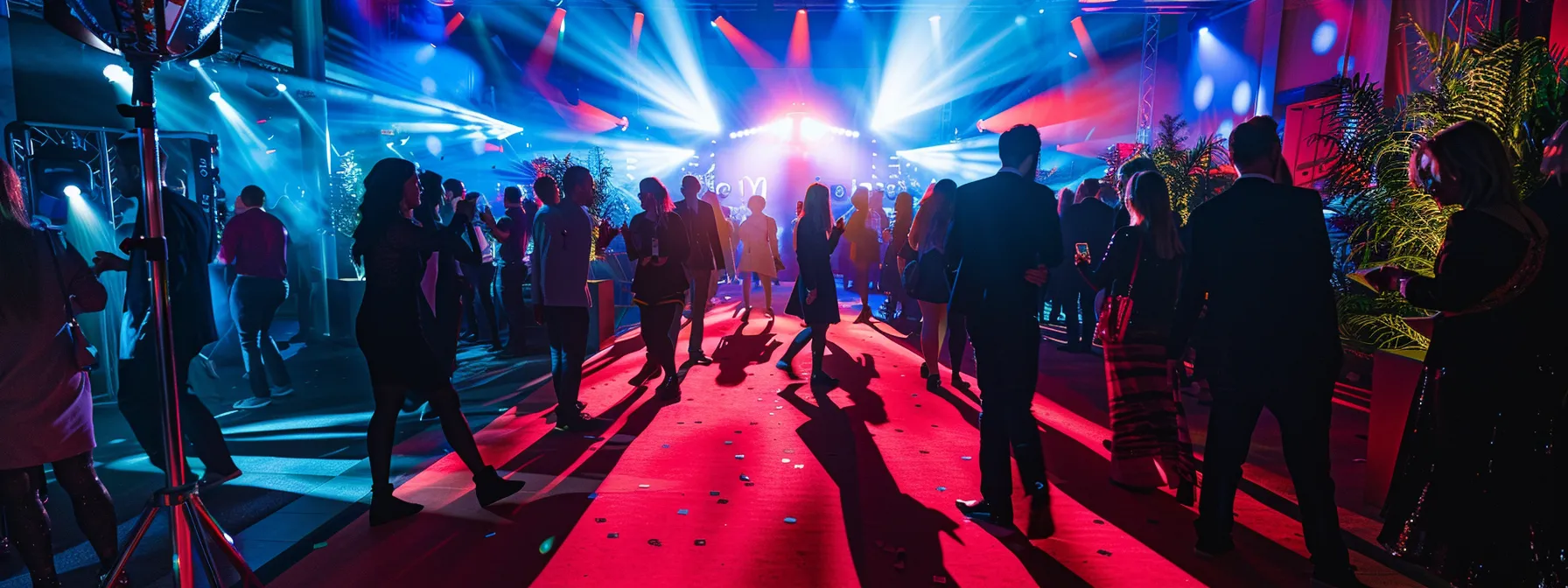 Find the Best Magic Mirror Photo Booth Rental Services Today 4 a vibrant party scene featuring an elegantly designed photo booth adorned with glamorous props and a red carpet setup, bustling with guests in festive attire capturing joyful moments during a lively event.